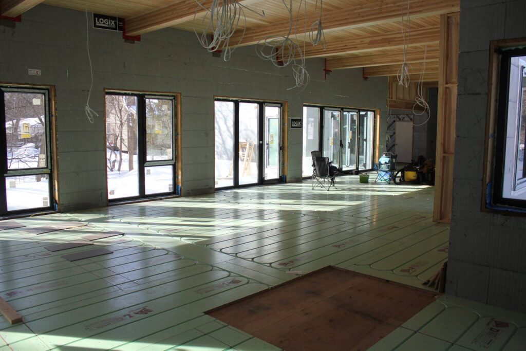 Warmboard-R panels laid over an existing floor in a large open room