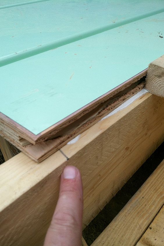 Edge of a Warmboard-S panel sitting on a timber joist